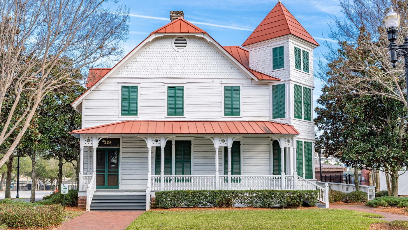Exterior view of the Jacksonville History Center’s downtown campus, featuring the historic red-brick Merrill House Museum.