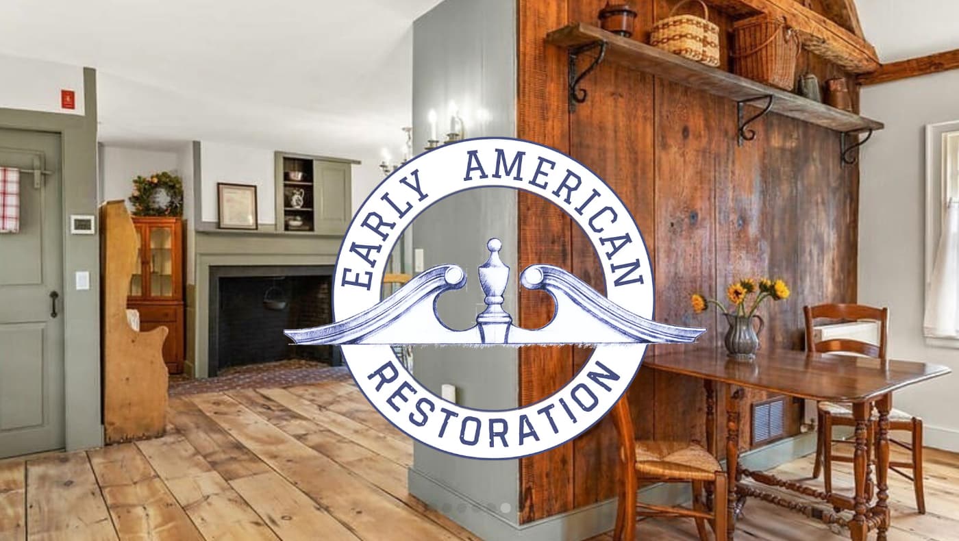 A meticulously restored historic front entry and living room in Framingham, MA, featuring original hardwood floors and period-accurate architectural details by Early American Restoration.