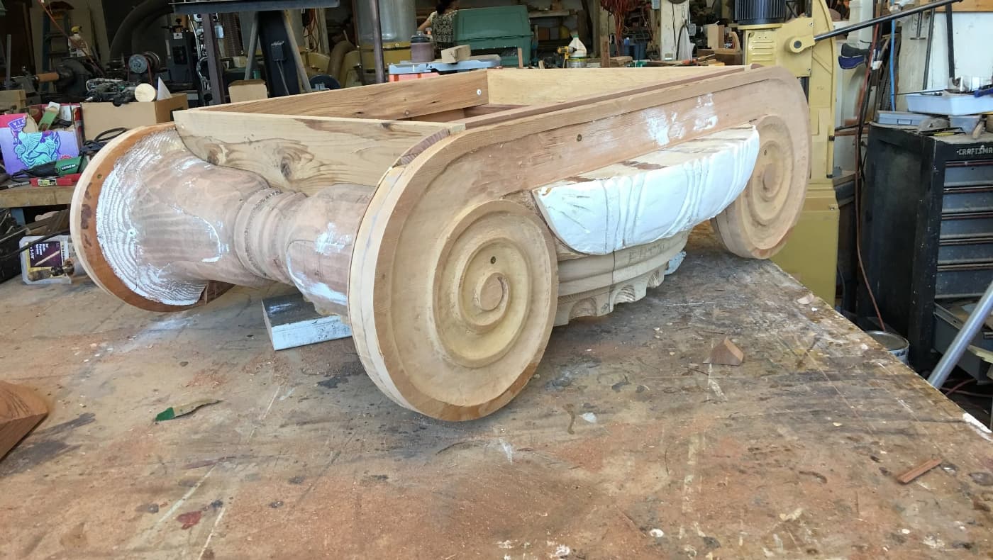 A meticulous close-up of a historic column capital restoration by The Turning Point Woodworks, Inc.