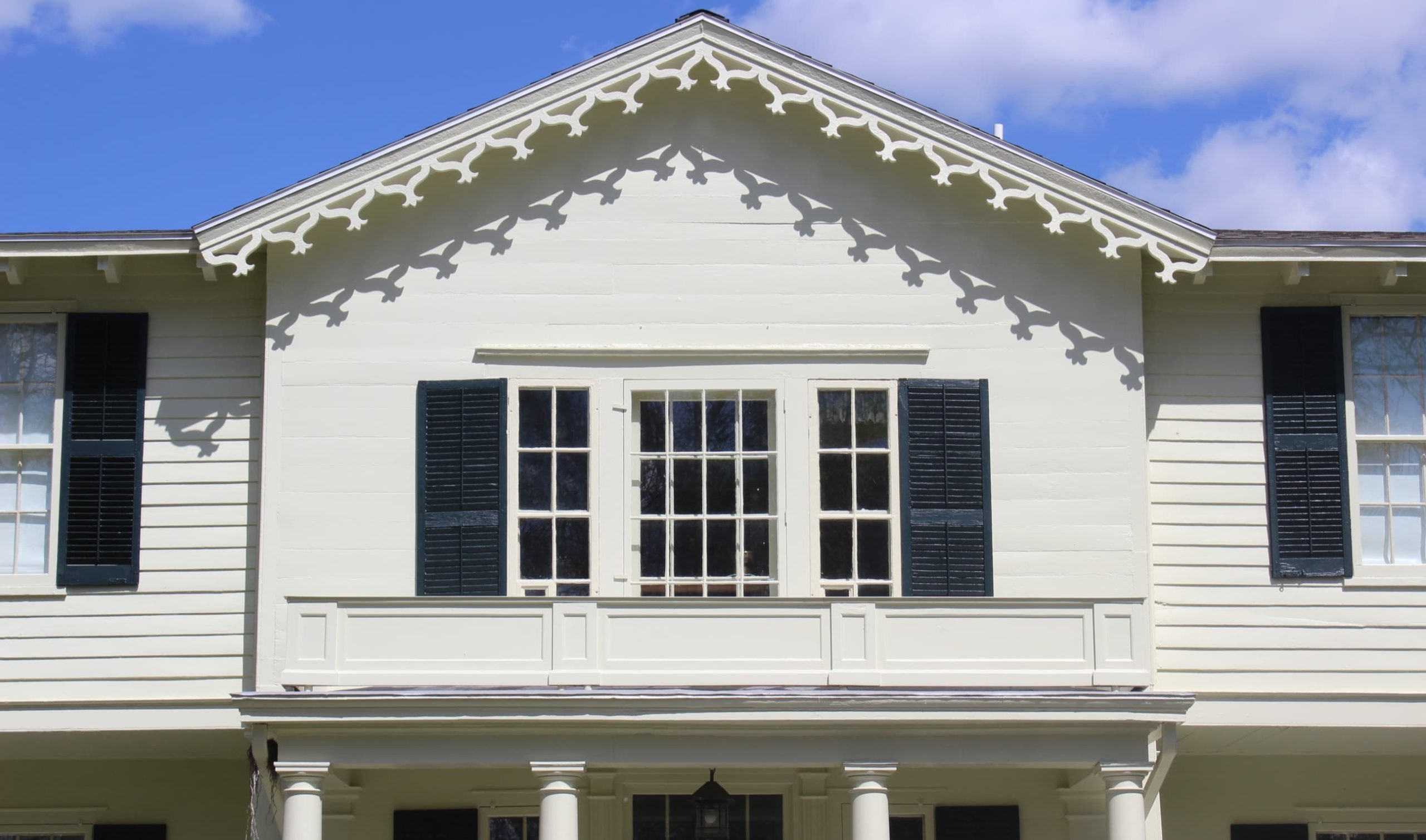 Historic inn in Geneva, NY overlooking Seneca Lake. The Victorian-style architecture features decorative vergeboard on the gables, typical of heritage lodging in the Finger Lakes region.