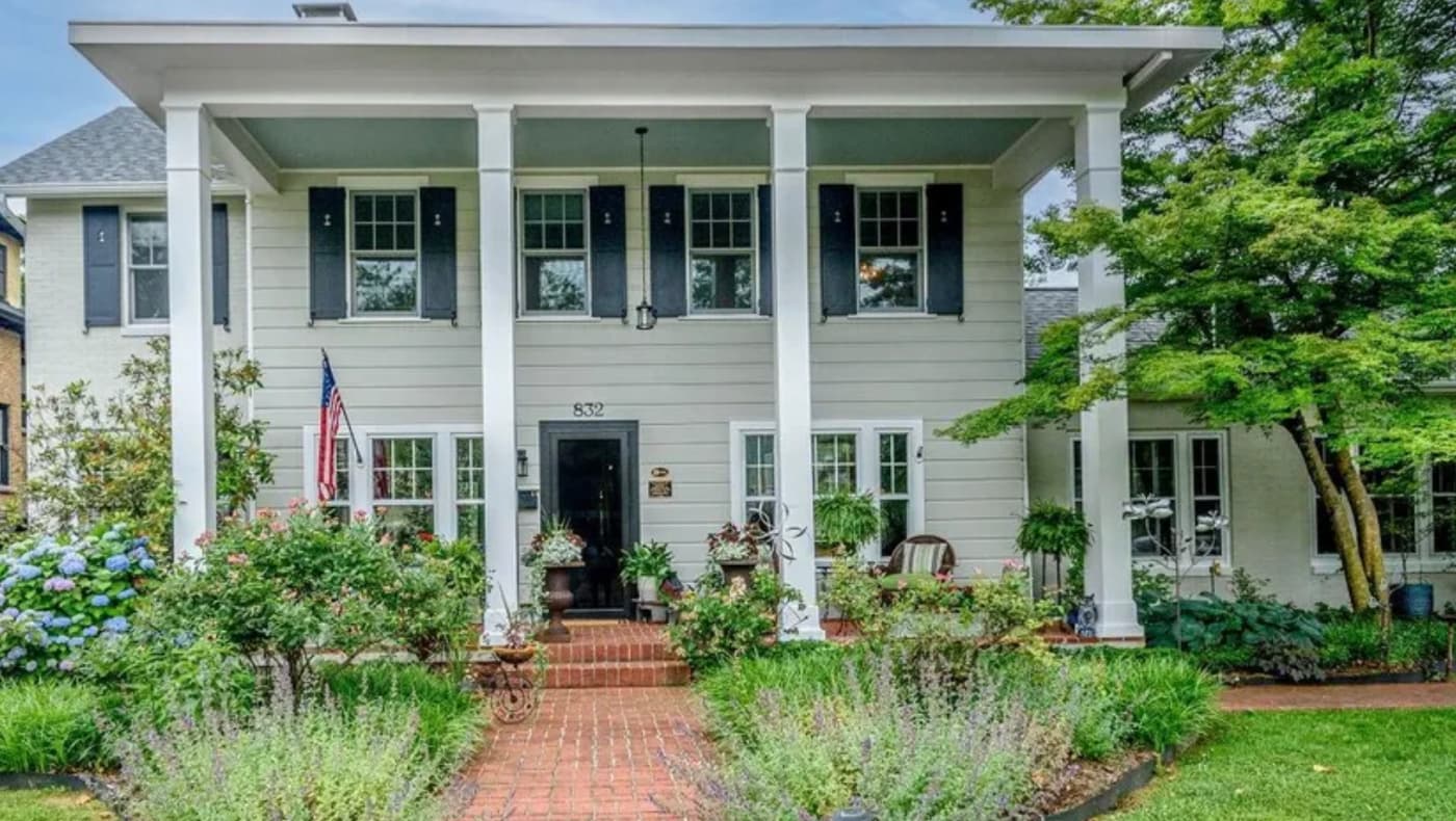 Front exterior of the historic Cecil F. Stonecipher House, a two-story Dutch Colonial or Neoclassical-inspired residence built circa 1926.