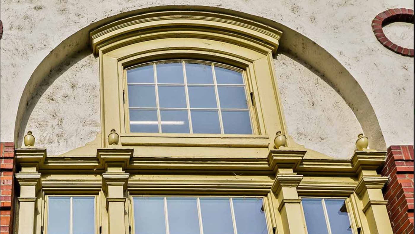 A close-up architectural photo showcasing a SLIP™ Slim Line Insulating Pane installation on a historic multi-lite window.