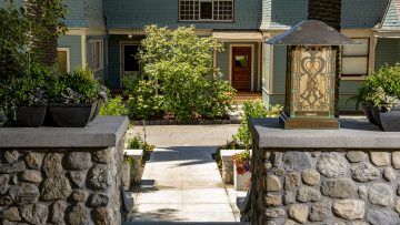 The front staircase, lighting and landscaping of the McNally Estate, an 1888 Victorian mansion restored by Brett Waterman.