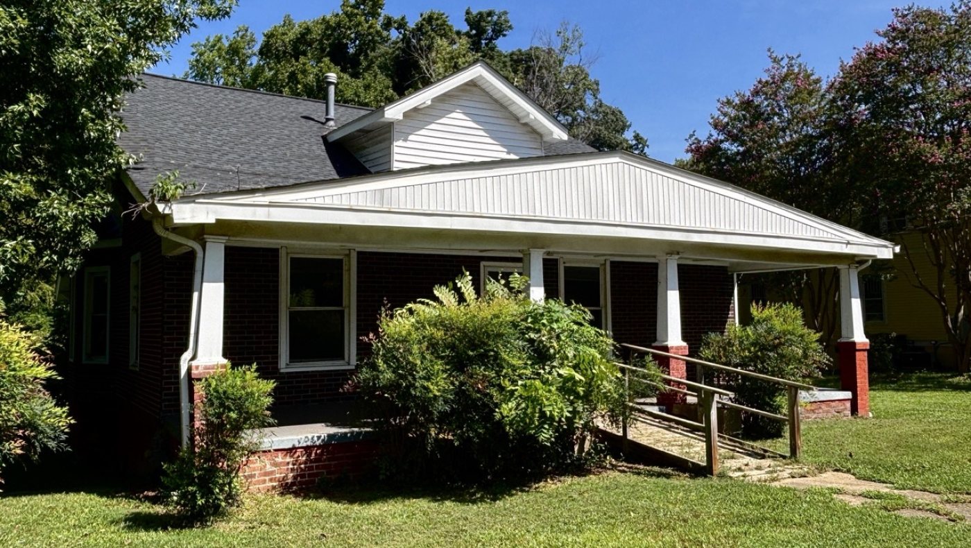 J.E. Anderson House in Salisbury, North Carolina: brick bungalow with a wide front porch on brick piers and a front-gabled dormer