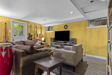 1938 Tudor Revival at 419 Lodges Lane, Elkins Park, Pennsylvania: basement family room with door to the rear yard