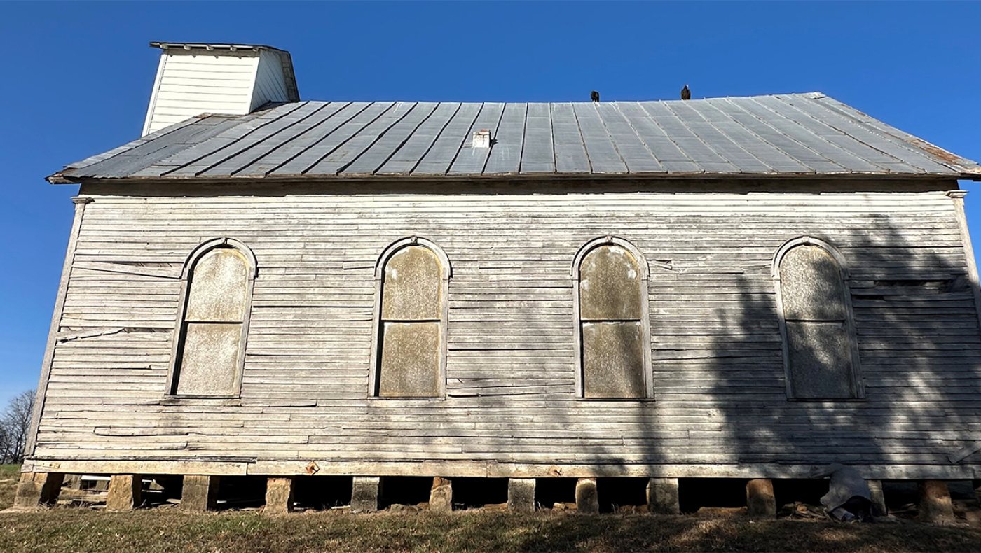 South Martin Church in Loogootee, Indiana: white frame country church with arched windows, a metal roof and a short steeple